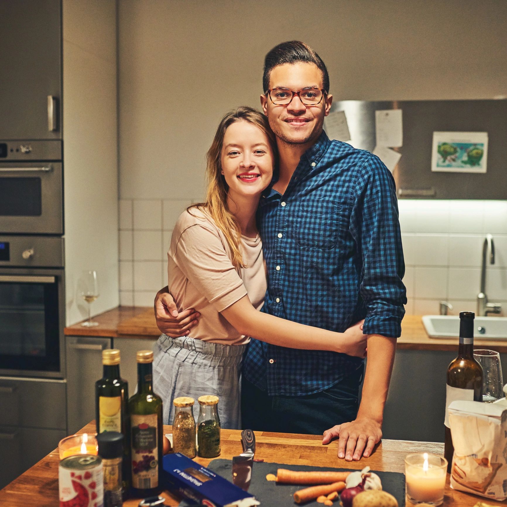 Couple cooking together in kitchen
