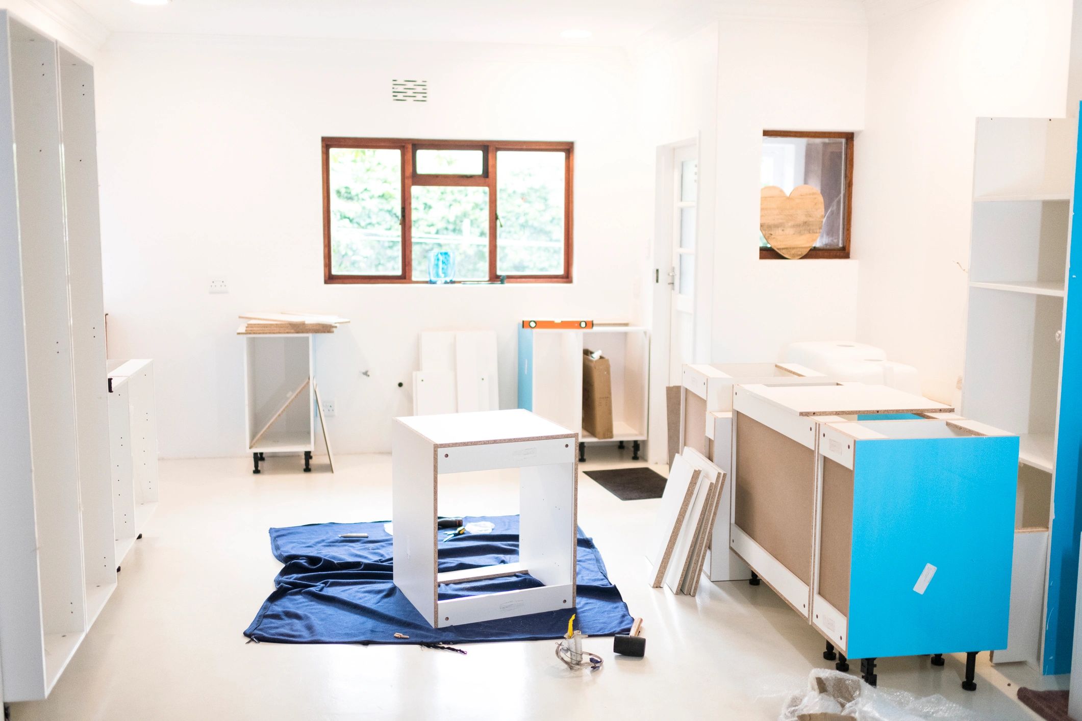 Kitchen cabinetry being assembled during installation